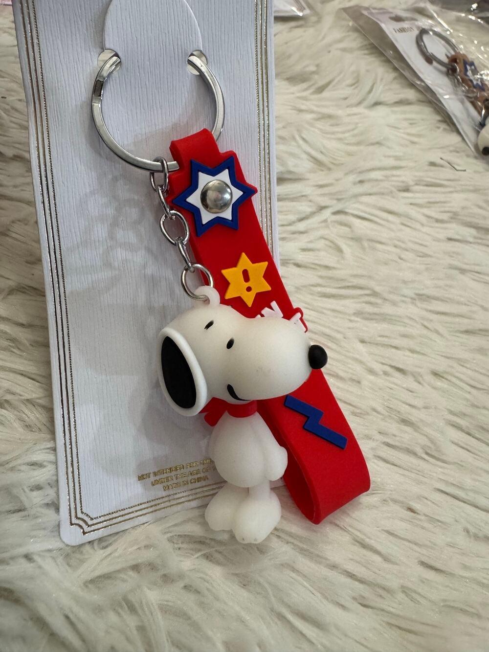 Snoopy keychain with red ribbon and strap blue lightning bolt